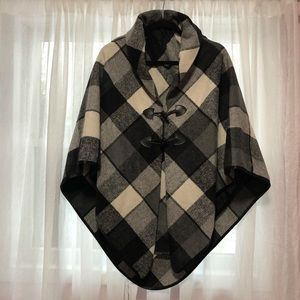 Black and white cape with toggle closure